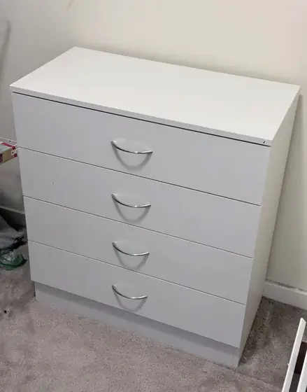 Assembled white four-drawer dresser
